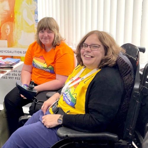Staff member with her carer at an event promoting the work of The Coalition