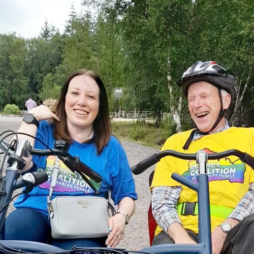 Two people enjoying themselves on a bike at Alice Holt Forest. This was a Get More Active Get Together