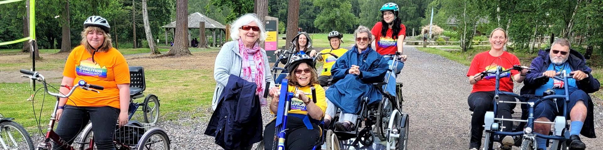 A group of members and staff at Alice Holt Forest cycling in the sunshine