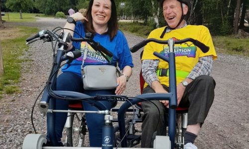 Yasmin, our Involvement Lead and Jonathan, Coalition Chair riding a tandem bike.
