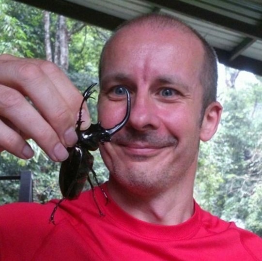 Photo of Rob holding a big beetle!