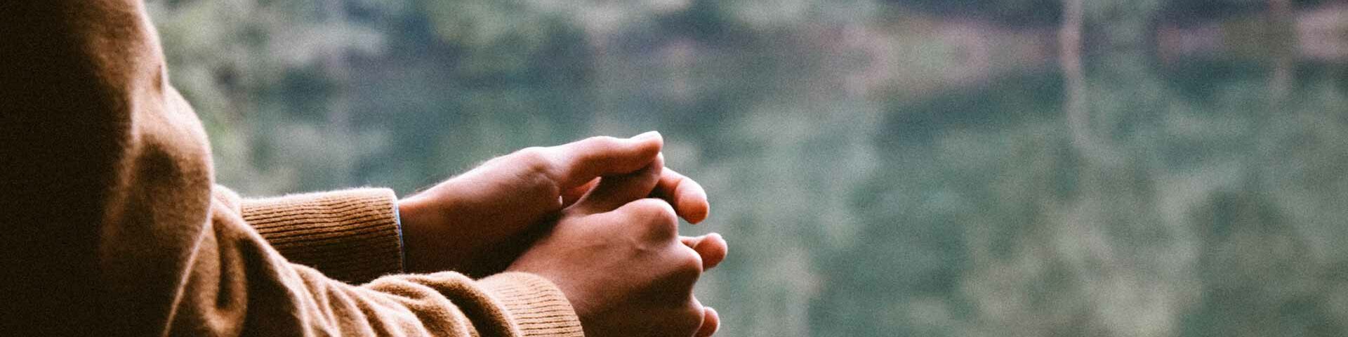 Photo of hands clasped