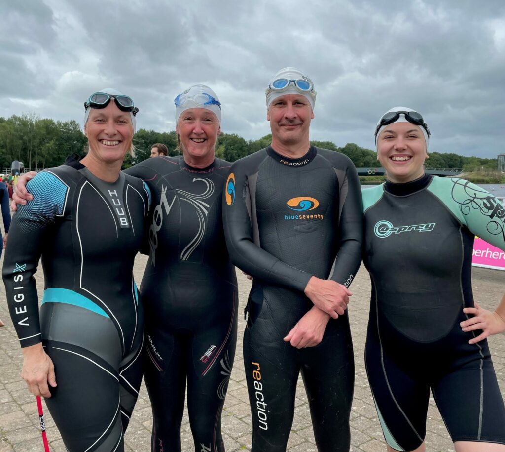 Our four swimmers in wetsuits, ready for their Superhero Tri swim