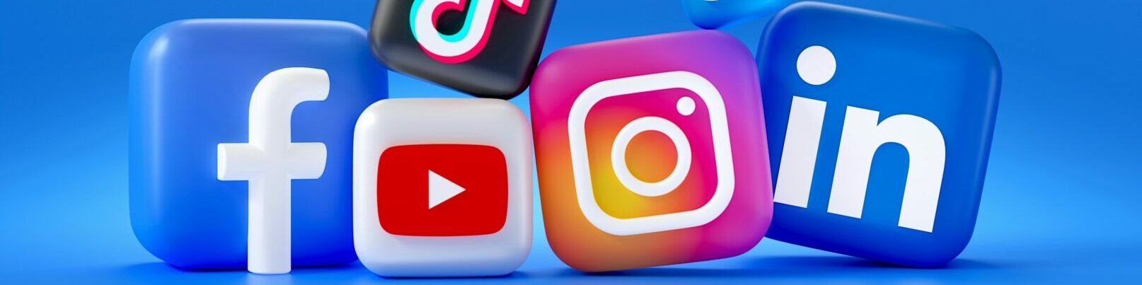 Blue background with five blocks that include the following social media logos: Facebook, TikTok, YouTube, LinkedIn and Instagram.