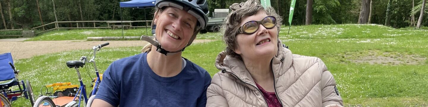 Coalition member Jane with Coalition staff member Katy on a side by side tandem bike.
