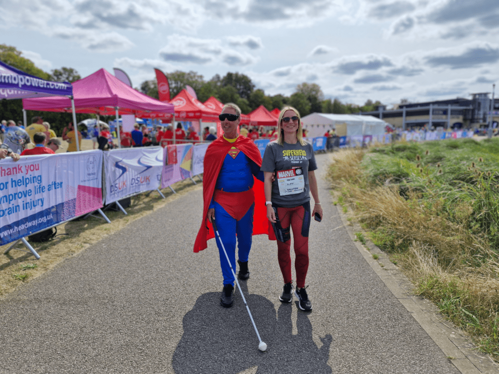 The Coalition's CEO, Nikki with Coalition member, Brian at the Superhero Tri event.